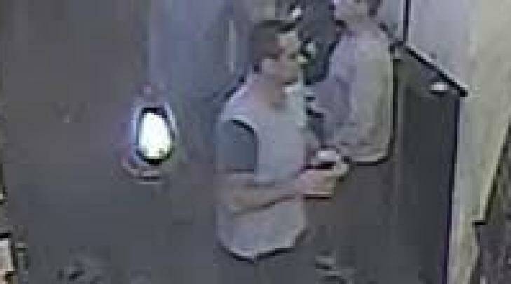 The man police wish to speak to has dark hair and a tattoo on his right bicep. Photo: Police Media