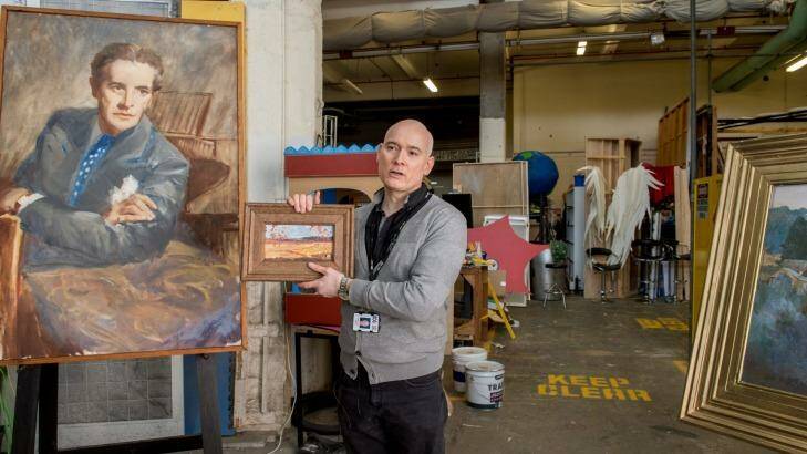 Veteran set buyer-dresser Andrew Best with one of the many paintings created by the props department backstage at the ABC's TV studios in Elsternwick. Photo: Penny Stephens