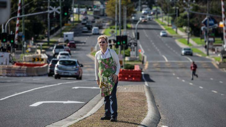 Bayswater Village trader Lilly stands in the median strip of the Mountain Highway. Photo: Jason South
