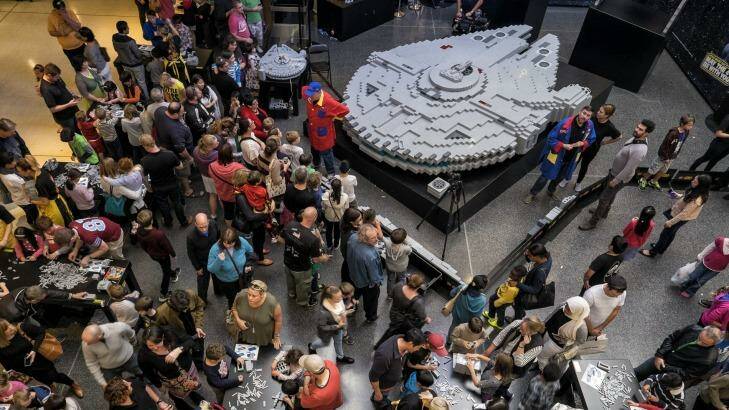 Families join forces at a LEGO event to build the Millennium Falcon to celebrate Star Wars Day at Westfield Southland. Photo: Luis Ascui
