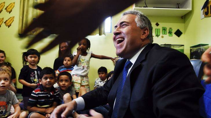 Child cheer: Joe Hockey at a Childcare centre in Padstow.
 Photo: Nick Moir