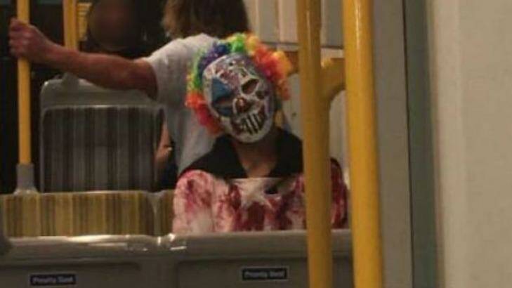 A clown photographed on public transport in Surfers Paradise on the Gold Coast. Photo: Supplied
