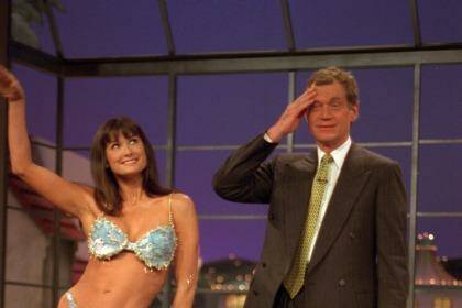 David Letterman reacts as actress Demi Moore poses in a bikini during taping of "Late Show With David Letterman," in 1995. Photo: AP/CBS