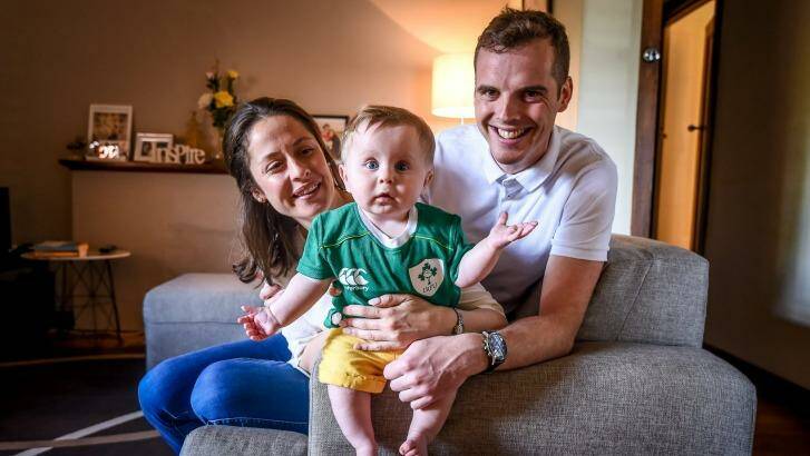 Irish man Liam Lenihan with his Australian partner, Tanya Grausam, and their seven-month-old son, Henry, at home in Hawthorn. Photo: Justin McManus
