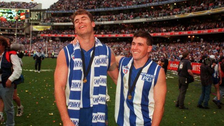 Wayne Carey and Anthony Stevens as teammates, after the 1996 Grand Final won by North Melbourne. Photo: Colin Murty