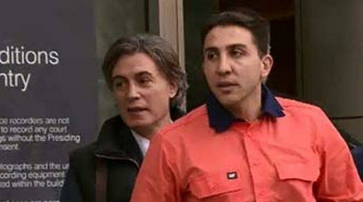 Court in the act: Gangland lawyer Joe "Pino" Acquaro, since murdered, leaves court with client Rocco Arico, in 2015. Photo: Courtesy Channel Nine