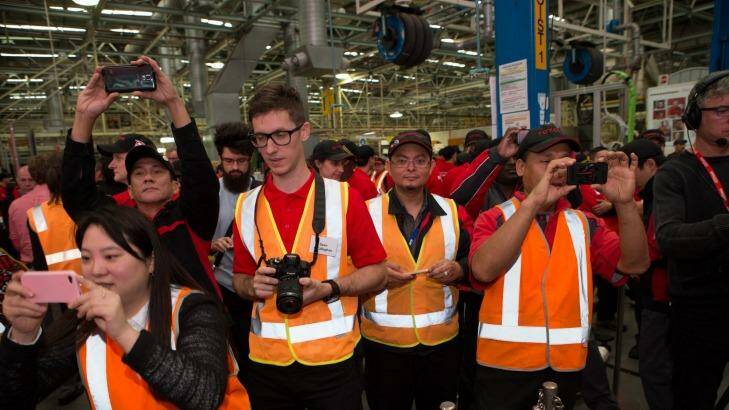 Toyota employees mark the occasion of the launch of the new Camry, the last car to be made in Australia at the Altona Factory.  Photo: Jason South
