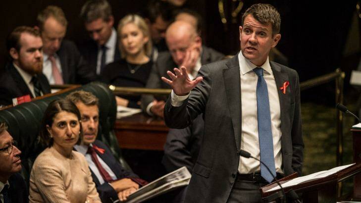 NSW Premier Mike Baird is being urged to put domestic violence leave on the national agenda at the Council of Australian Governments meeting late this month. Photo: Wolter Peeters