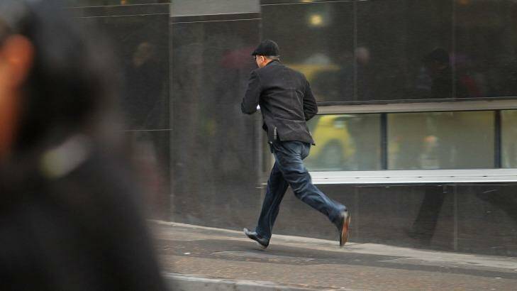 Alleged cat burglar Di Miao, 53, makes his getaway from Melbourne Magistrates Court on Monday. Photo: Pat Scala