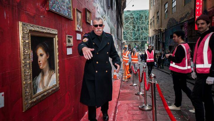 Lush's public art event in Hosier Lane Street saw art patron Andrew King posing as museum security. Photo: Josh Robenstone