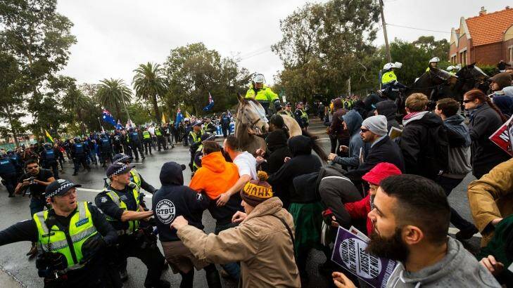 Police hold back members of the 'Say no to Racism' group who were protesting an anti-Islam rally organised by the True Blue Crew and backed by the United Patriots Front.  Photo: Chris Hopkins/Getty Images