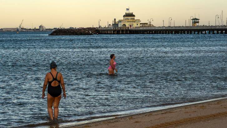 Cooling down at St Kilda beach after another hot Melbourne night. Photo: Justin McManus