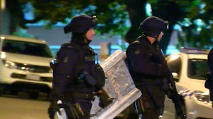 Police in riot gear prepare to enter the Parkville youth centre in November.  Photo: Courtesy ABC News
