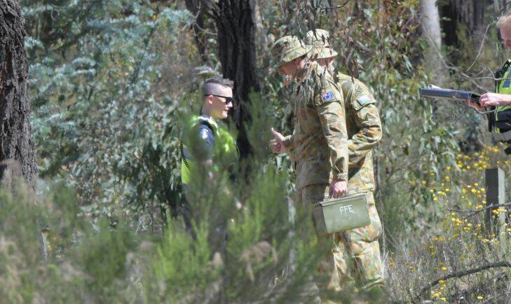 Police call in the army to help dispose of two world war 2 grenades found in bushland behind the cemetary.

Picture: DARREN HOWE Army officers retrieve the grenades from bushland near the Quarry Hill cemetery. Picture: DARREN HOWE