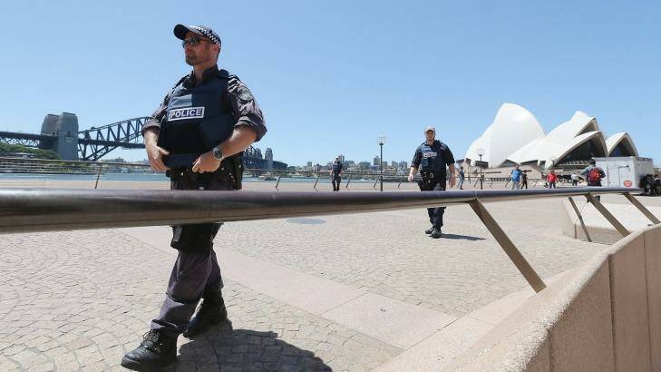 Armed police patrol near the Sydney Opera House on December 15. Photo: Joosep Martinson via Getty Images