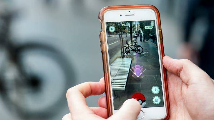 The augmented-reality app game enables players to walk around their physical world catching Pokemon.  Photo: Penny Stephens