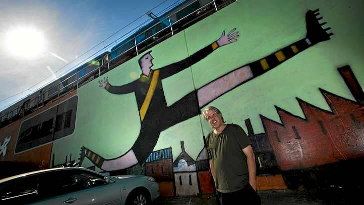 Artist Nick Howson in front of his mural <i>Tiger Legend</i> he painted next to Richmond Station. Photo: Justin McManus