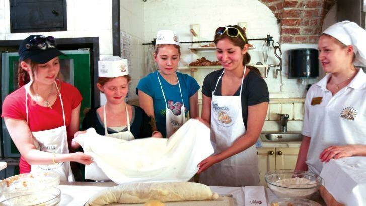 Kids learn to make strudel on a Tauck river cruise.
