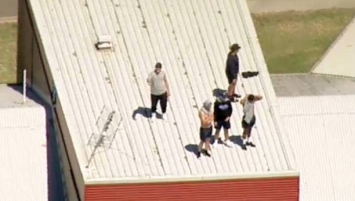 Youths on the roof of the Malmsbury Justice Centre. Photo: Nine Network