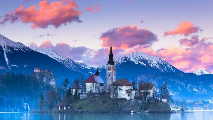 Sunset view of Julian Alps, Lake Bled with St. Marys Church of the Assumption on the small island. Photo: iStock