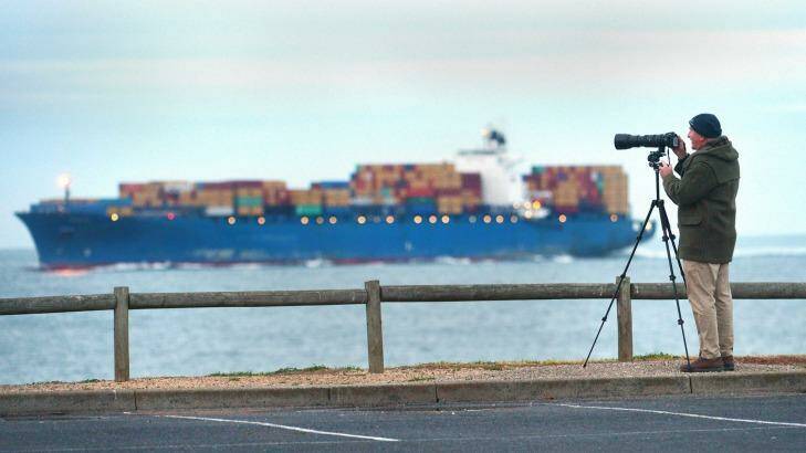 Graham Flett photographs the Pangal, one of the largest container ships to enter Port Phillip Bay. Photo: Joe Armao