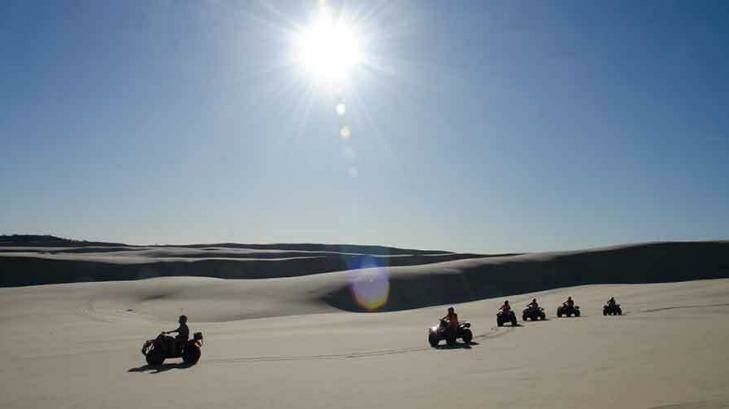 The bikes' tyres are kept at a low pressure to minimise the impact on the landscape. Photo: Sand Dune Adventures