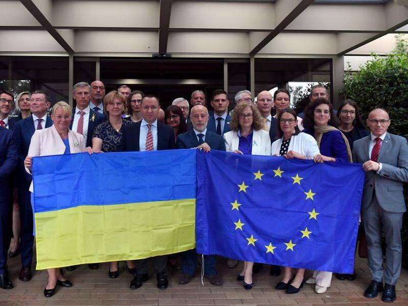 Ambassadors from an EU delegation show solidarity with Ukraine's Ambassador to Australia. (Dominic Giannini/AAP PHOTOS)