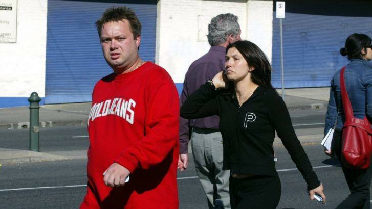 Carl Williams with his wife Roberta at the scene of a gangland murder in 2004. Photo: Angela Wylie