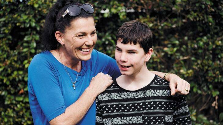 Ally McLeod with her son Connor McLeod, a 15-year-old who was born blind and convinced the Reserve Bank to introduce tactile banknotes. 
 Photo: James Brickwood