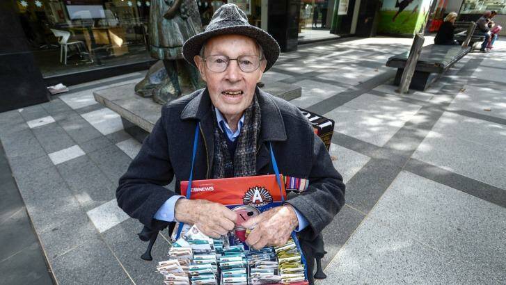 Graham Malloch selling Anzac pins in Melbourne. Photo: Justin McManus