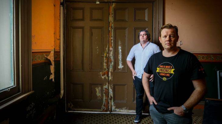 Luke  Hikakari and Matt Kunkel with a door that's seen better days. Photo: Eddie Jim