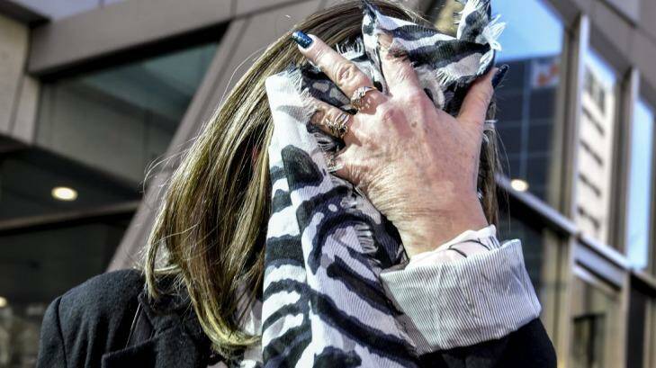 Joanne De Bono covered her face with a scarf outside court on Thursday. Photo: Eddie Jim