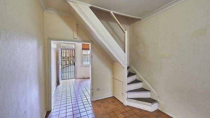 The Surry Hills home was in a rundown statte and only slightly wider than a queen-sized bed.