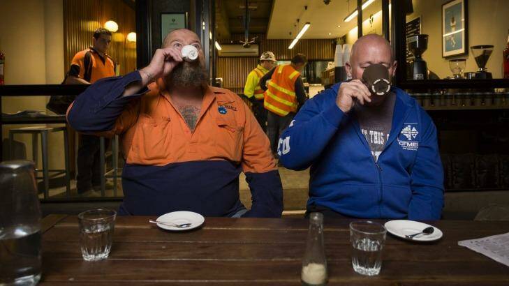 Construction workers Ron Horn and David Jones enjoy early morning coffee at Spriga Espresso Bar on King Street, Melbourne. Photo: Paul Jeffers
