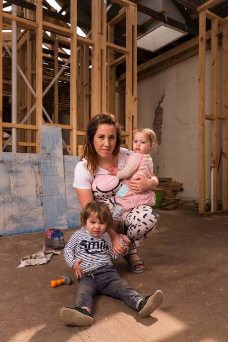 Lucy Sinclair and her 17-month-old twins, Everly and Harvey, pose for a photo at the construction site of their home, in Northcote, Melbourne. November 10th 2017. Photo: Daniel Pockett Lucy Sinclair and her 17-month-old twins, Everly and Harvey, pose for a photo at the construction site of their home, in Northcote, Melbourne. November 10th 2017. Photo: Daniel Pockett