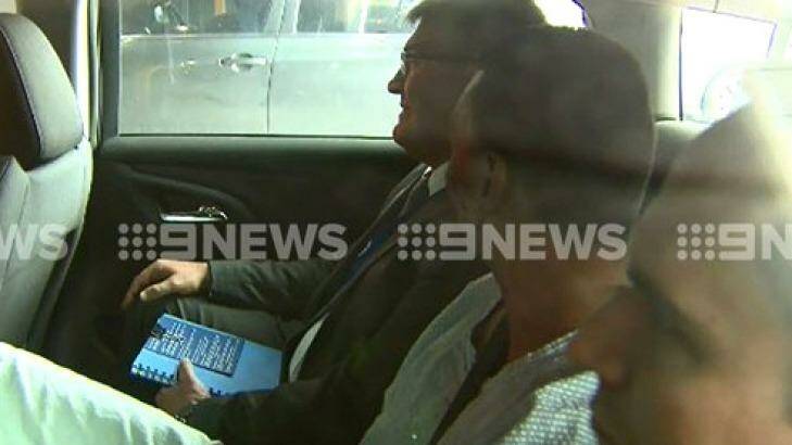 Dimitrious Gargasoulas being taken by police for questioning on Monday. Photo: Channel Nine