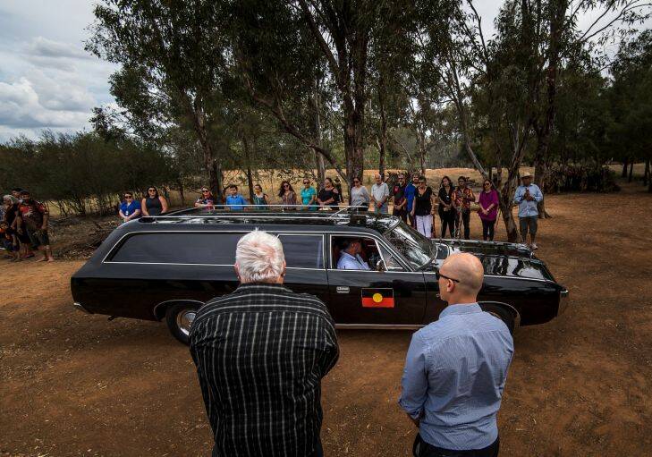The Age, News, 15/11/2017, photo by Justin McManus.
Repatriation of Mungo Man's remains along with 104 other ancient ancestors back to conutry at Lake Mungo. The remains will be taken from thre National Museum of Australia's  storage faciclity in Canberra in the old Aboriginal hearse accompanied by elders from the Willandra region - the Mutthi Mutthi, Paakantyi?????? and Ngiyampaa?????? people. They will travel and be welcomed with ceremony from local elders at Wagga Wagga, Hay and Balralnald before being laid to rest at Lake Mungo. The hearse at the arrives at the ceremonial site in Wagga Wagga.