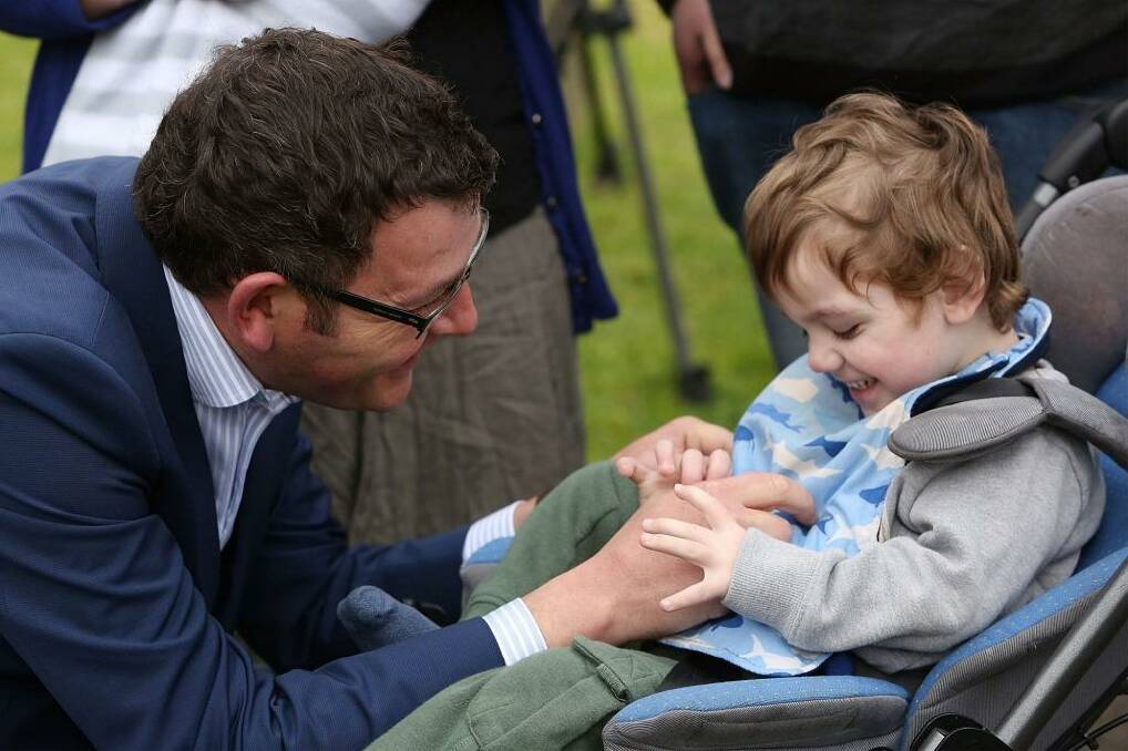 Daniel Andrews with Cooper Wallace before the Victorian election. The now Premier is pushing for a bill to legalise medical marijuana before parliament before the end of next year. Photo: Graham Denholm