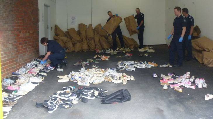 Police sort through the stolen shoes. Photo: Supplied