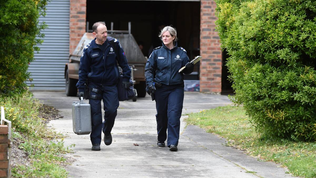 Police at the Bell and Talbot Street property. Picture: Lachlan Bence.