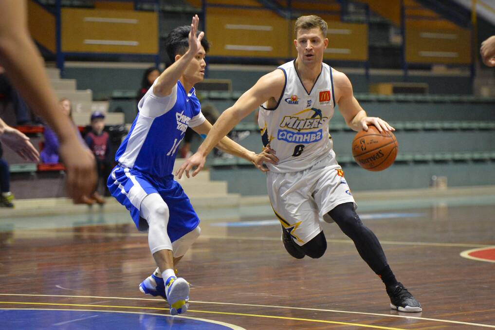 EVASIVE SKILLS: Miners star Ash Constable makes his way past Chinese Taipei player Chiang Yu-An in an international showdown at the Mars Minerdome on Sunday. Picture: Dylan Burns 