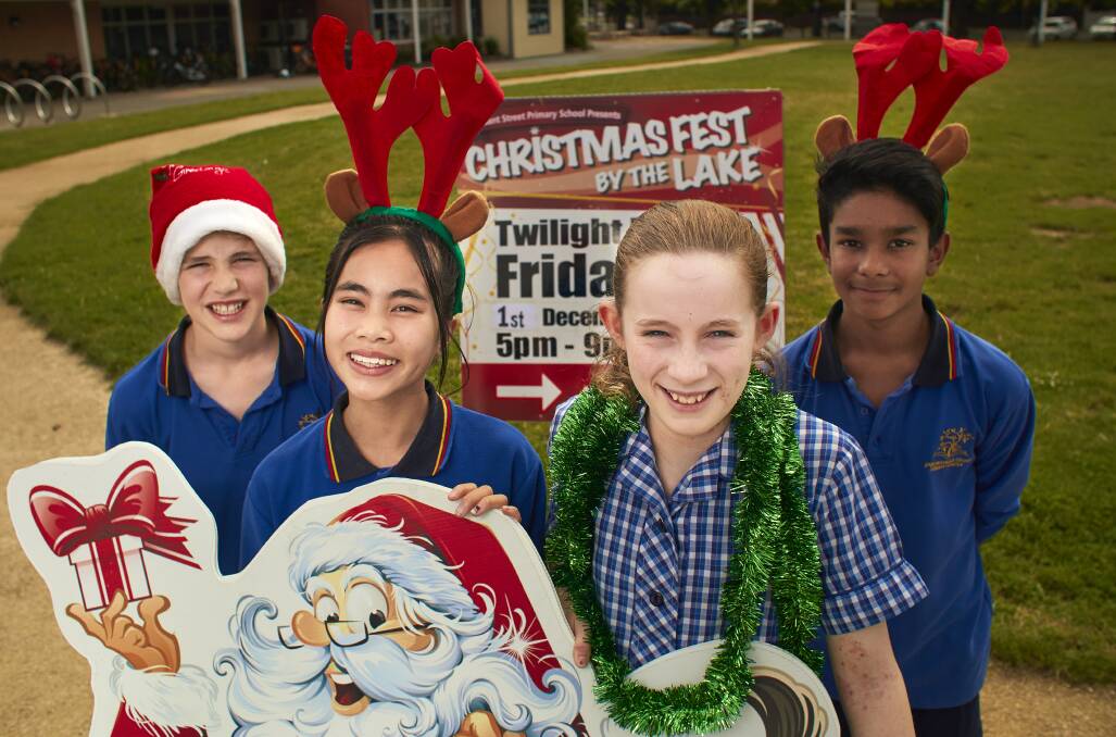 PARTY TIME: Pleasant Street Primary School year 6 pupils Edward, Francesca, Emma and Rohan are getting ready for the school's event of the year, Christmas Fest by the Lake, which includes rides, market stalls and Santa Land. Picture: Luka Kauzlaric 