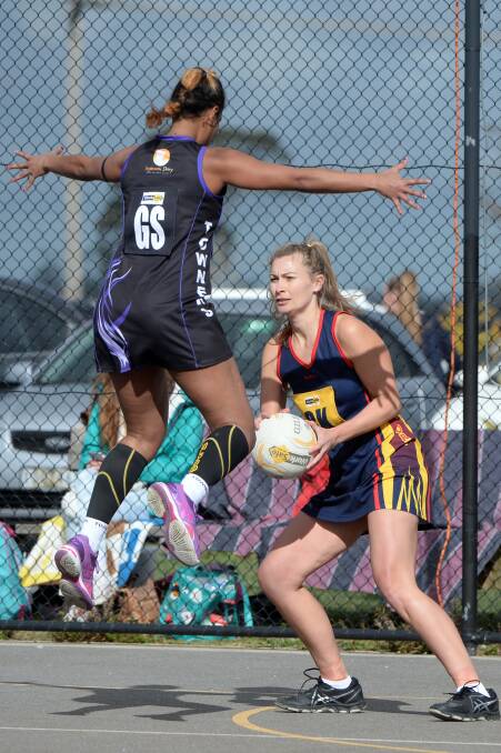 RISING UP: Dunnstown's Elenoa Costello takes to the air to defend against Rebecca Lofts from Beaufort in a qualifying final at Bungaree on Saturday. Pictures: Kate Healy 