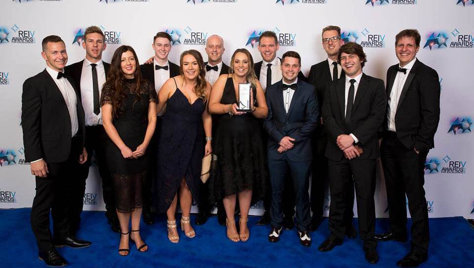 PROUD: The Ballarat Real Estate team with its prestigious award at Crown Palladium. 