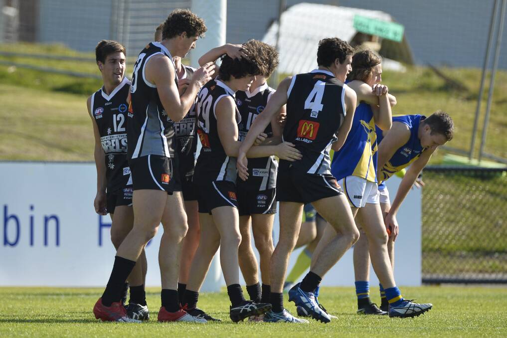 The team helps debutant Jack Antonio celebrate one of his two goals. Picture: Dylan Burns