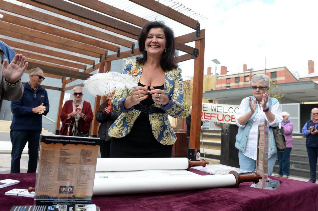 SHOWING SUPPORT: Mayor Samantha McIntosh signed the Welcome Scroll on behalf of the Ballarat City Council and the community during Harmony Day celebrations on Wednesday at Alfred Deakin Place. Picture: Kate Healy