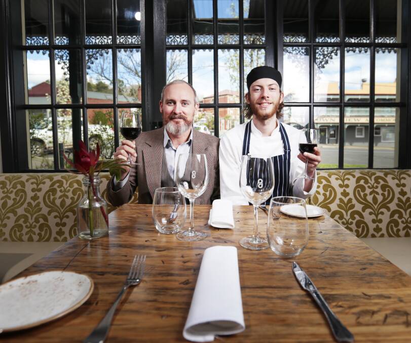 FINE DINING: General manager Leon Lyndon and apprentice chef Liam Scott at The Perfect Drop in Daylesford toast their Fine Food Australia medals. Picture: Luka Kauzlaric