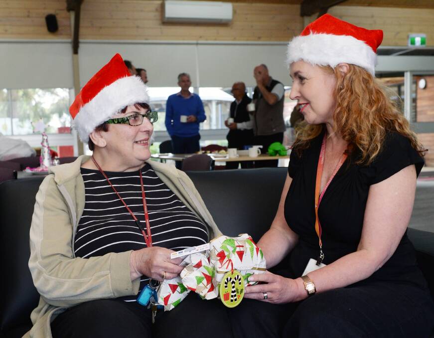 EXCHANGE: McCallum client Evelyn Boyle and Anita Godfrey from Telstra Ballarat. Picture: Kate Healy