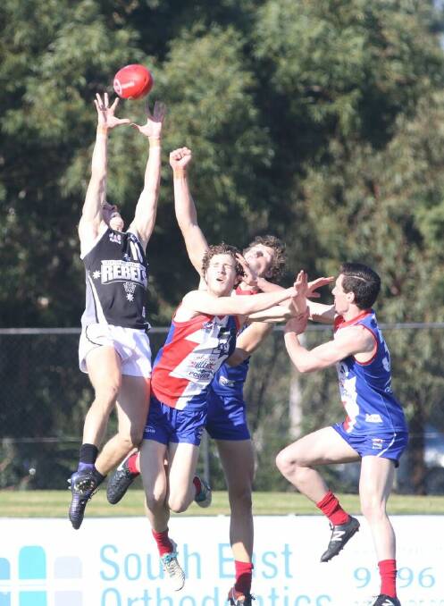 STRONG MARK: Rebels forward Jordan Johnston flew high for this mark during what was a tough battle between Greater Western Victoria and Gippsland until the final quarter. Picture: On Deck Media 
