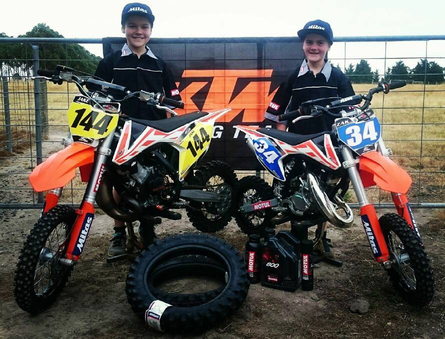 GOOD EFFORT: Jake, 10, and Zak Sanderson, 8, stand with their bikes at their property outside of Ballarat. The brothers will compete in the final round of the Victorian Junior Motocross titles in July. Picture: Karen Morriss